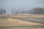 The runway with buildings and hangars